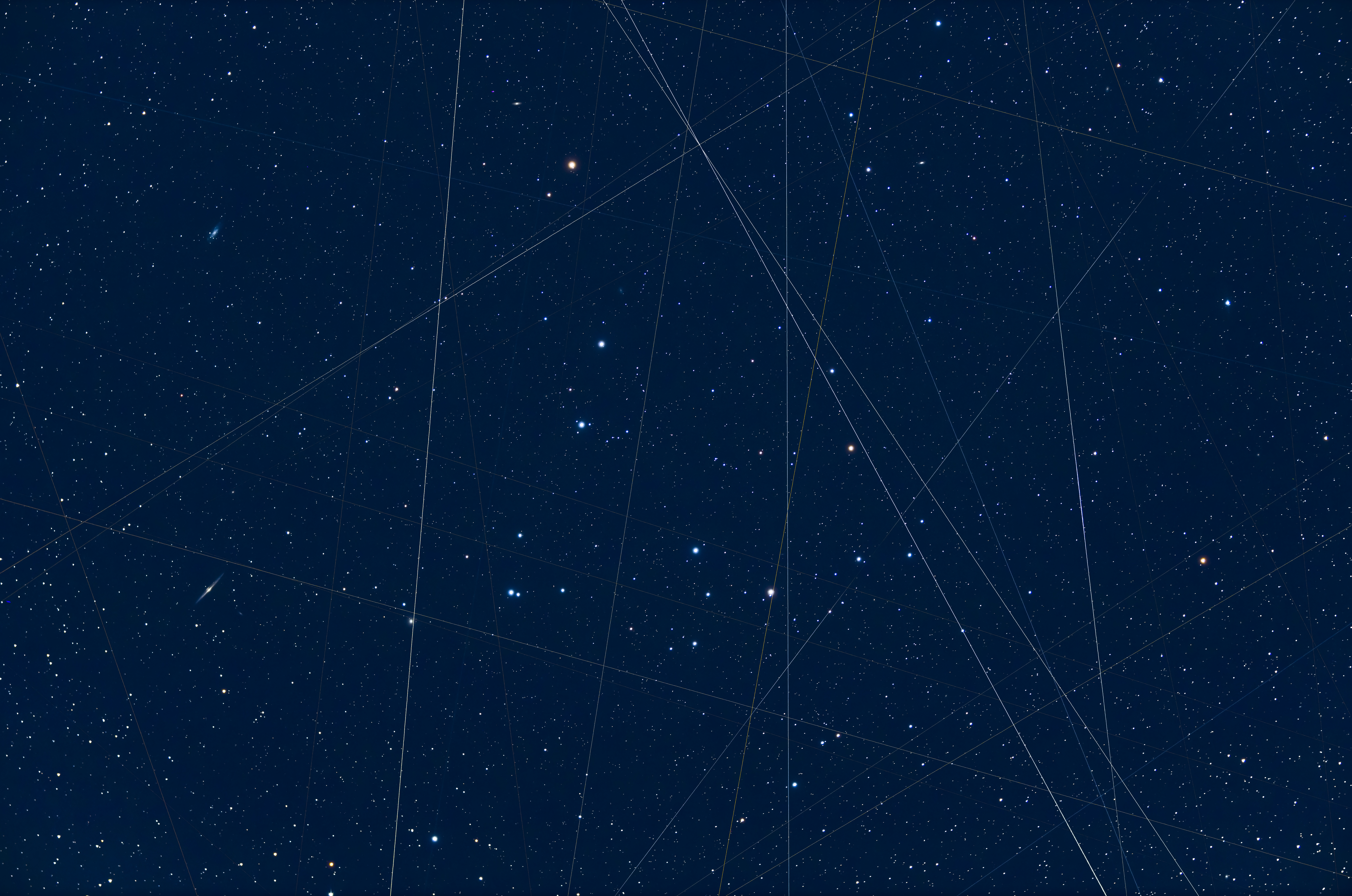 Satellites and light pollution: Multiple satellites streak through this composite of the Coma Berenices cluster, shot through a wide-field telescope over the course of about an hour. The trails mostly run north-south, so the photographer posits they are due to polar-orbiting satellites, rather than the largely west-east tracks of Starlink.