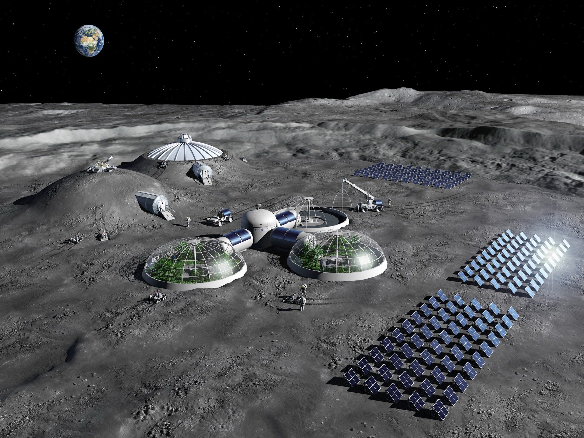 This artist impression of a Moon base shows olar arrays for energy generation, greenhouses for food production, and habitats shielded with regolith. Credit ESA.