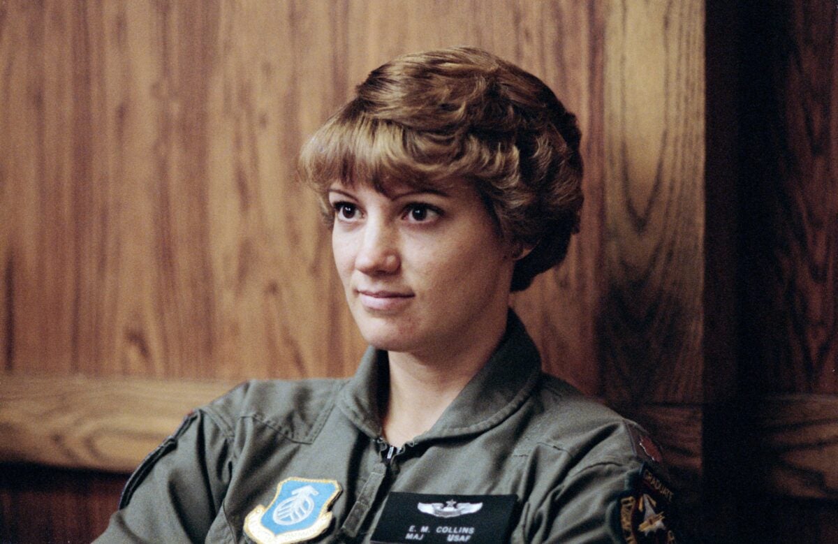 Eileen M. Collins, then an astronaut candidate, listens to a briefing on parachute ejection in 1990. Photo credit: NASA