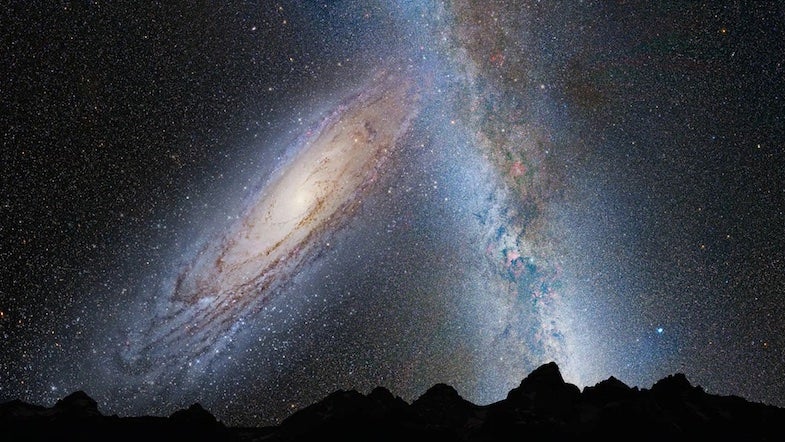 In another 3.75 billion years, the Andromeda Galaxy (left) will loom large in Earth’s skies, as rendered in this illustration. By this time, the massive galaxy’s gravity will have begun to distort the plane of our Milky Way, at right. 