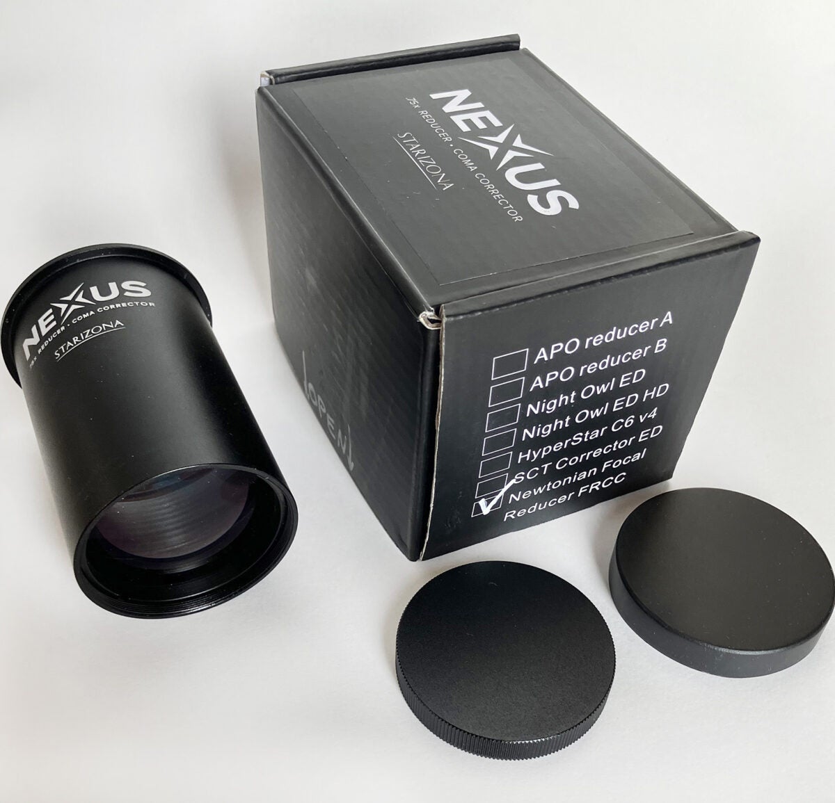 : The Nexus coma corrector (to the left of the box) comes with a metal cap for its 48mm threaded camera end and a plastic cap for the lens end. All parts are packaged in a custom, foam-lined box.