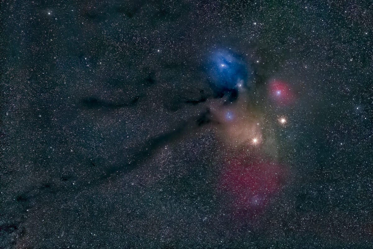 The variable star Antares shines brightly at 1st magnitude and is located in the Rho (ρ) Ophiuchi cloud complex, a giant molecular cloud composed partly of bright ionized hydrogen and largely of dark dust.