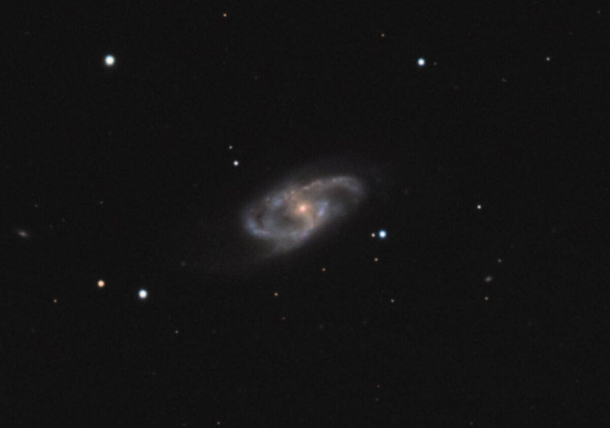 NGC 150 is infrequently imaged, but doing so reveals its fainter extended outer arms.