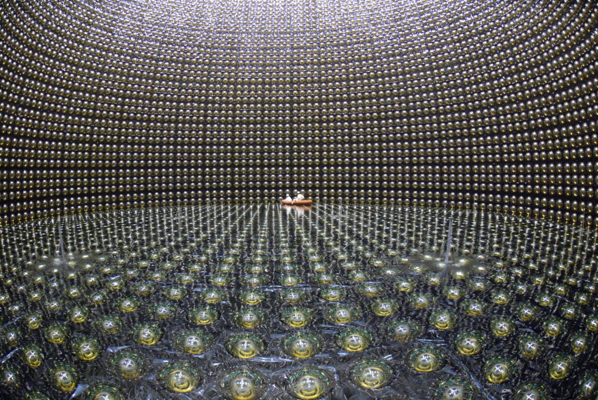 Japan’s Super-Kamiokande Observatory consists of some 13,000 photodetectors in a water-filled tank 129 feet (39.3 m) wide by 136 feet (41.4 m) tall located nearly 3,300 feet (1,000 m) underground. When a neutrino interacts with the atoms in the water, it creates a brief flash of light, called Cherenkov radiation, that is picked up by the detectors. Here, the tank is being refilled with water in April 2006. 