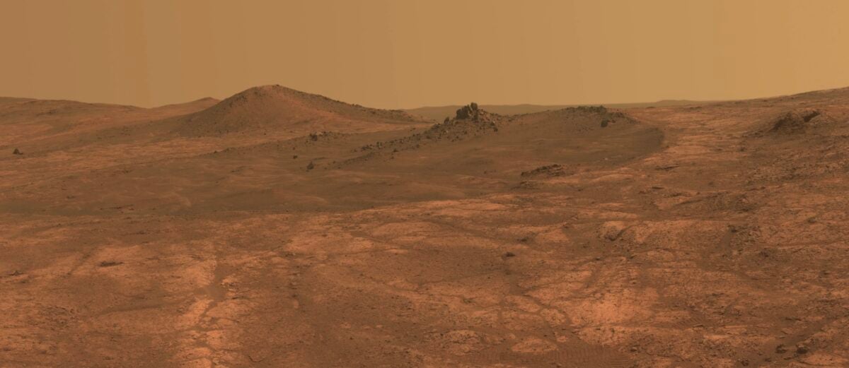 An elongated crater called "Spirit of St. Louis," with a rock spire in it, dominates a recent scene from the panoramic camera (Pancam) on NASA's Mars Exploration Rover Opportunity.