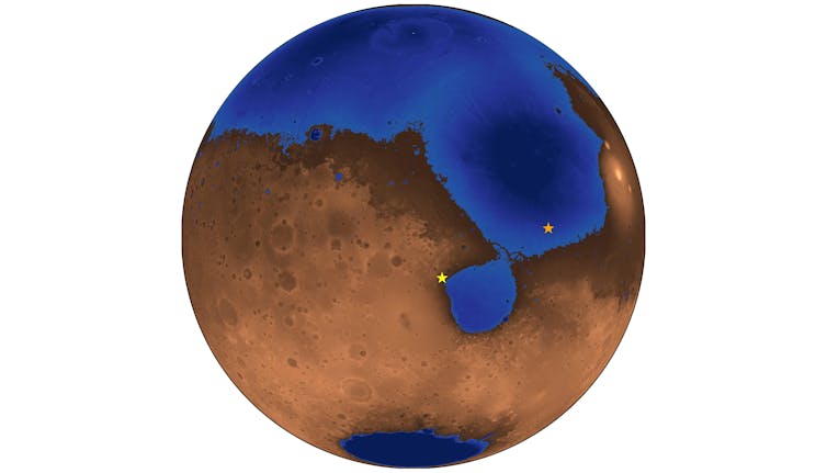 A large body of water covering most of the northern portion of an orange planet.