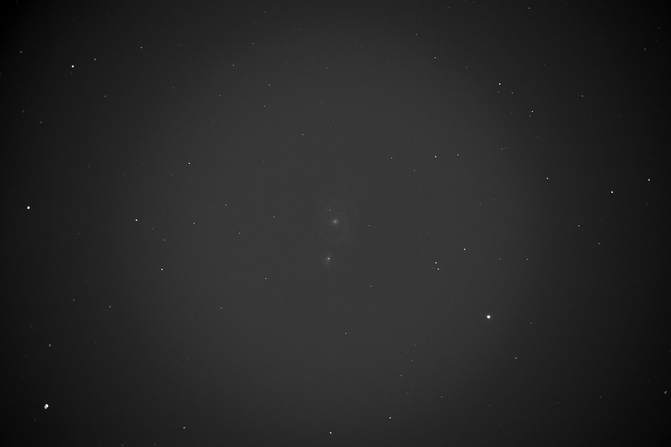 : An original, uncalibrated subframe of the Whirlpool Galaxy (M51). 