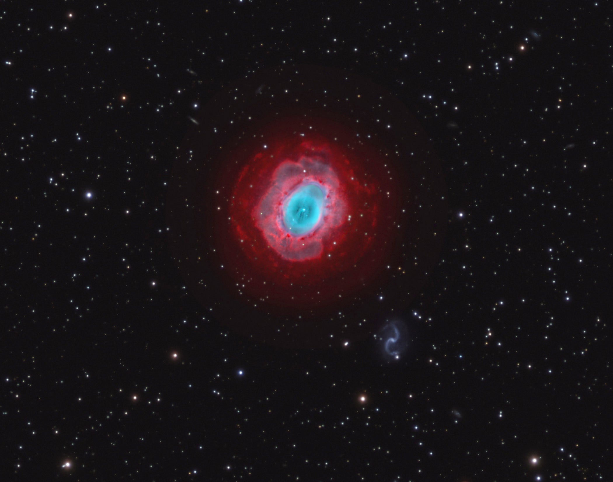 This wide-field view of the Ring Nebula (M57) in Hα/OIII/RGB filters comprises exposures of eight, three, three, three, and three hours, respectively.