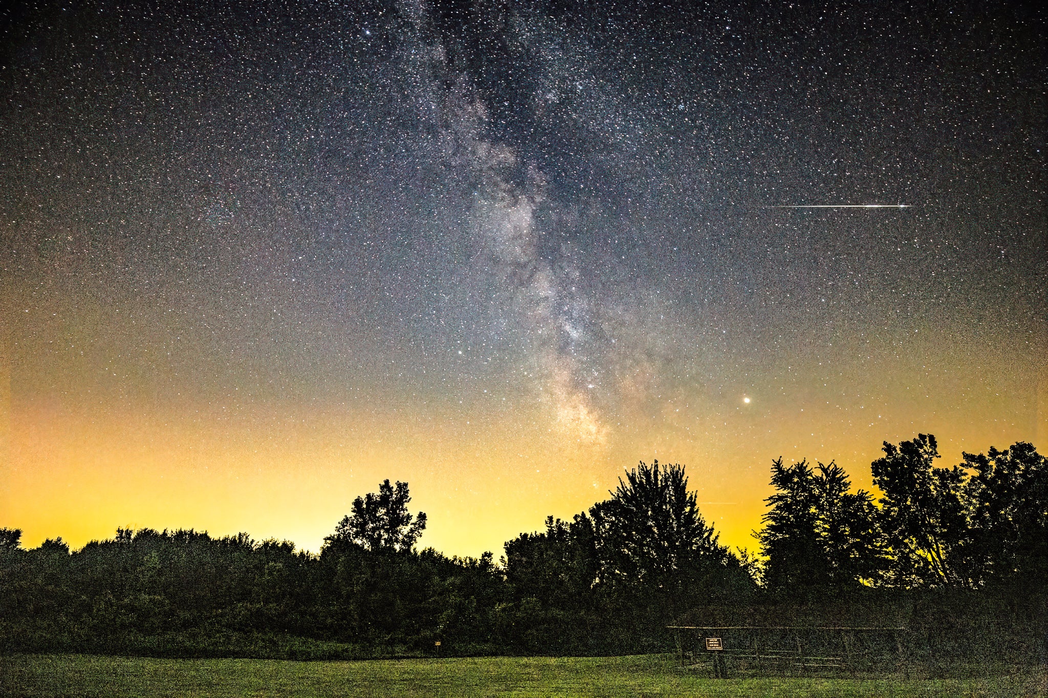 A chance meteor appears in this nightscape taken from the dark-sky preserve at Lake Hudson in Michigan. This shot is a single 20-second exposure taken at ISO 6400 with a Tamron 17–35mm lens at 17mm and f/2.8.