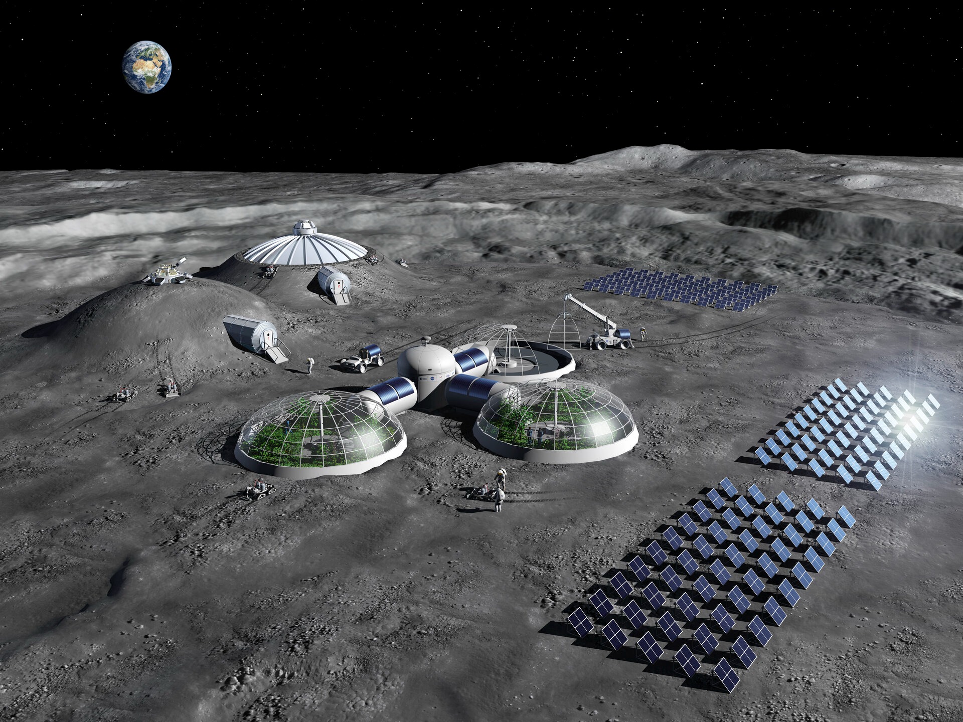 This artist's impression of a lunar base shows solar arrays for power generation, greenhouses for food production, and protected habitats with regolith.  ESA credit.