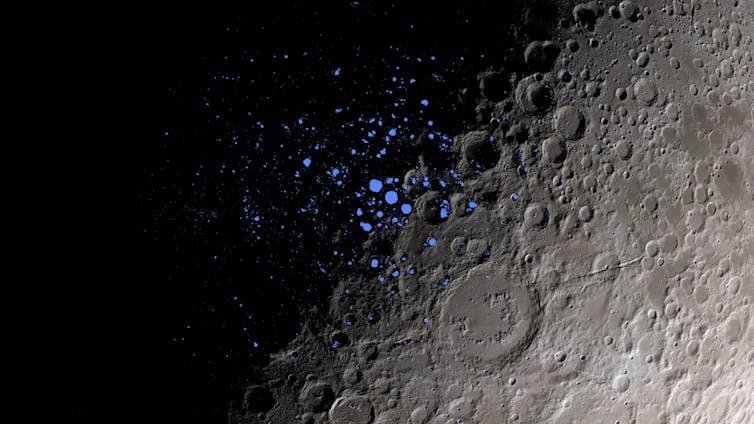 The Moon's dark craters, parts of which are indicated here in blue, never receive sunlight.  Scientists believe that some of these permanently shadowed regions could contain water ice.  Credit: NASA Goddard Space Flight Center